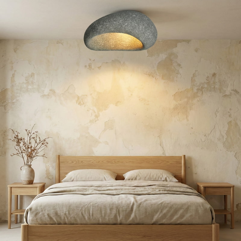 Bedroom with wooden bed, side tables, and a textured wall with a Nordic Lamp.