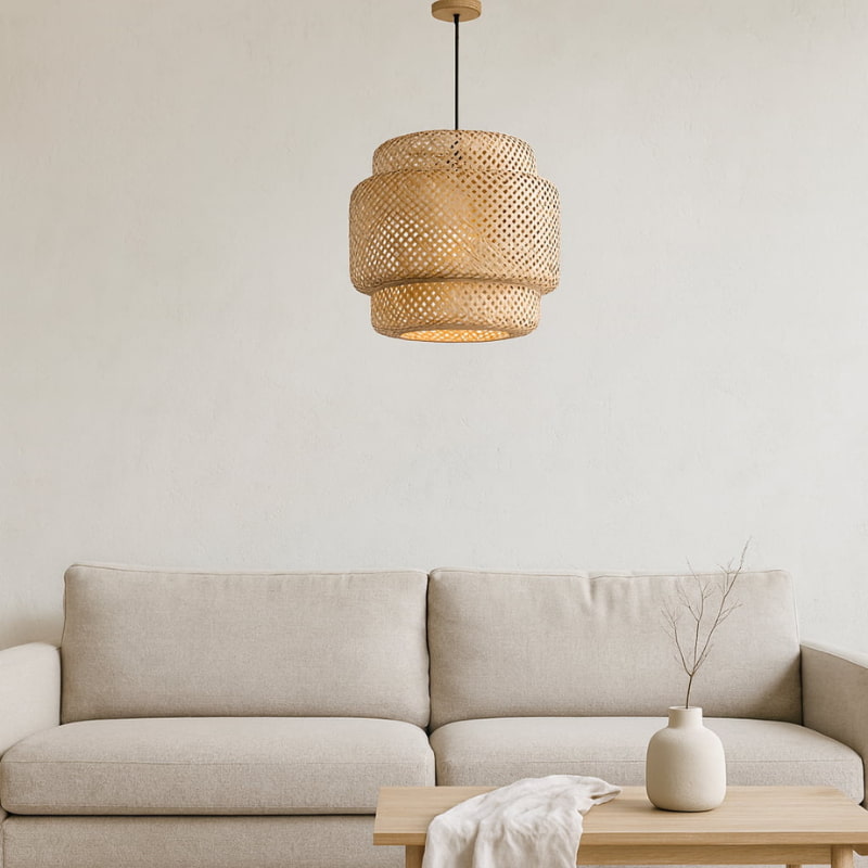 bamboo home decor light hanging above a beige sofa with a neutral background
