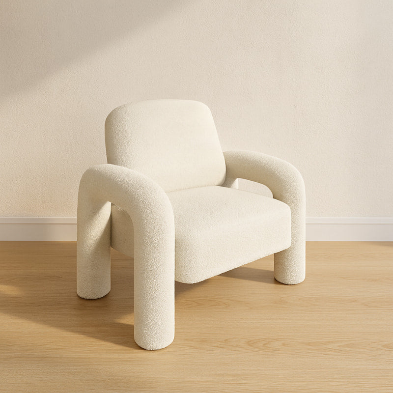 best comfortable reading chair on a wooden floor with a plain wall background