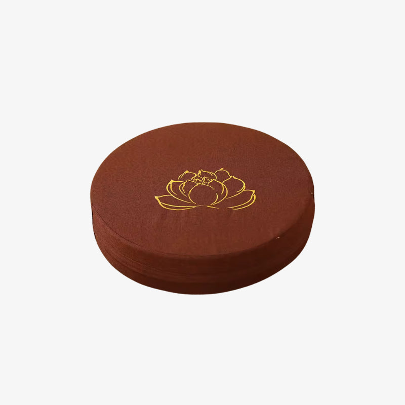 big floor cushion with a gold lotus design on a white background