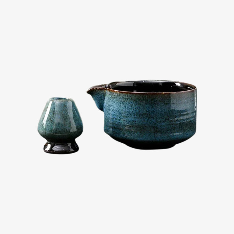 Blue ceramic teapot and blue sky ceramic tea cups on a white background