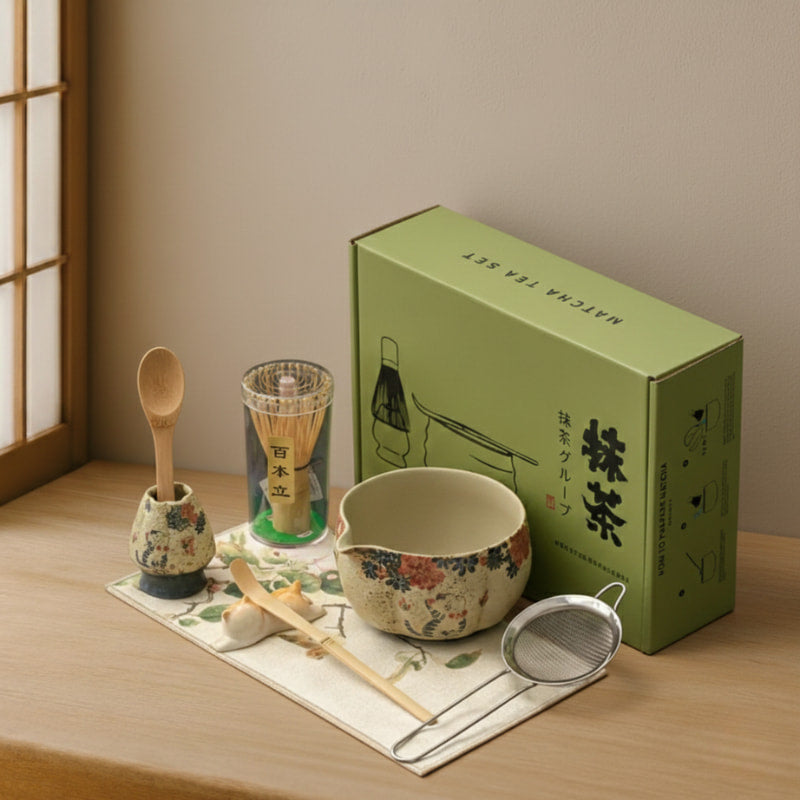 cat matcha bowl tea set with a green box on a stone surface
