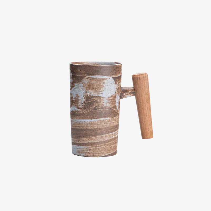 ceramic coffee mug with wood handle on a white background