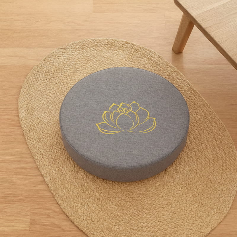 grey cushion flooring with a yellow lotus design on a woven mat