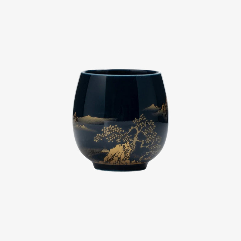handmade japanese tea cup with gold tree design on a white background