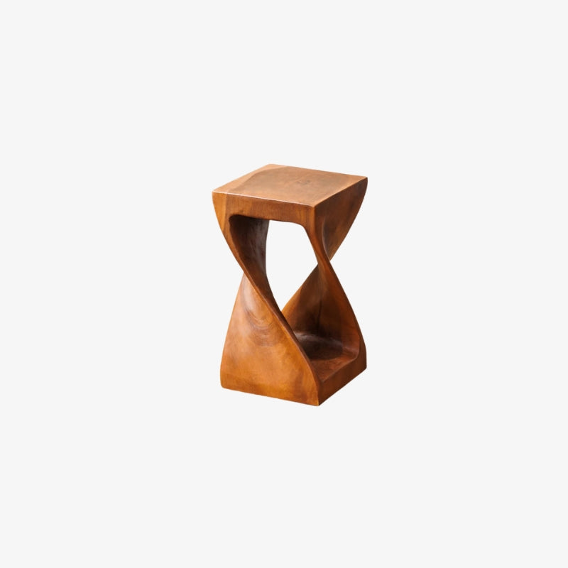 handmade wood stool with a twisted design on a white background