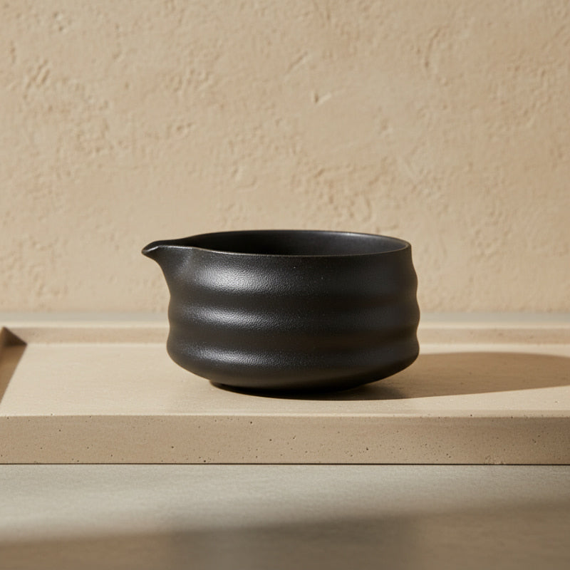 harmony matcha tea bowl on a beige surface with a beige background