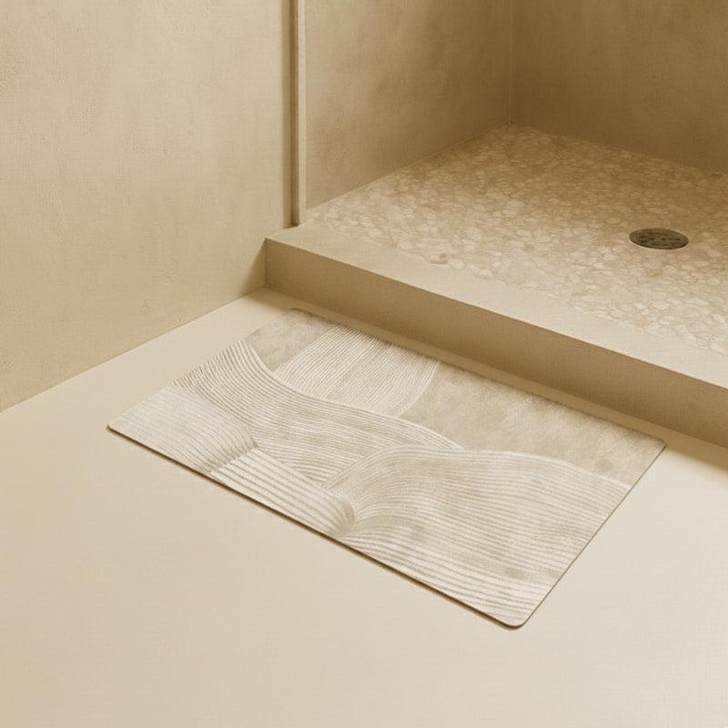 Beige japandi mat with subtle pattern on a bathroom floor