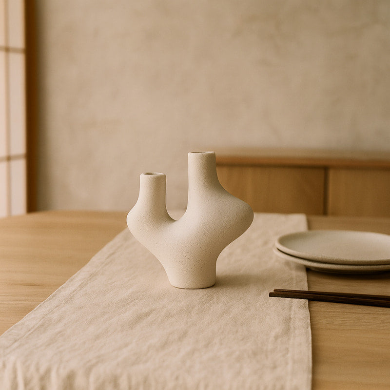 Japandi vase on a table with a neutral background