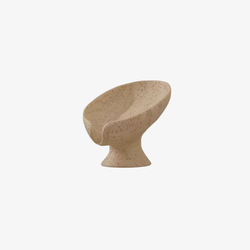Beige leaf shape soap holder on a white background