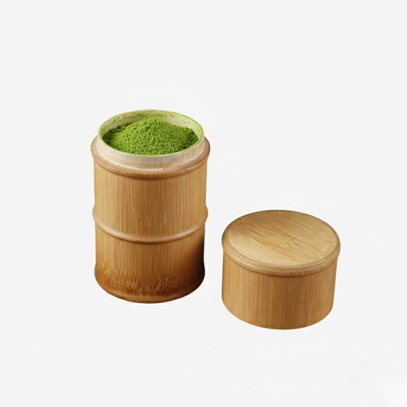 Bamboo matcha powder box with green powder on a white background