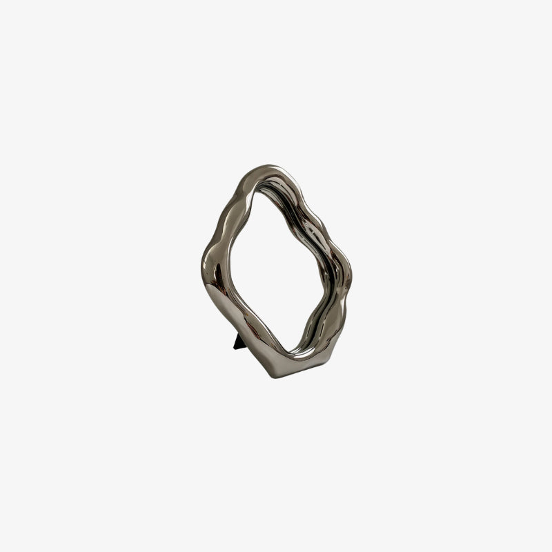 mini mirror with a wavy design on a white background