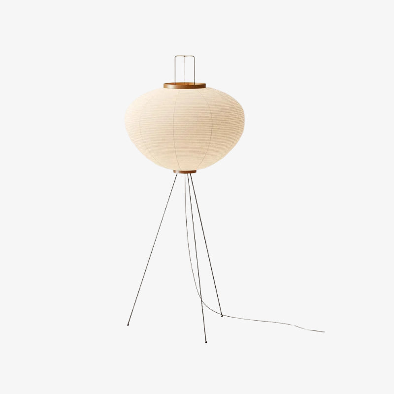 modern floor lamp japandy ambient light with a round beige shade and metal legs on a white background