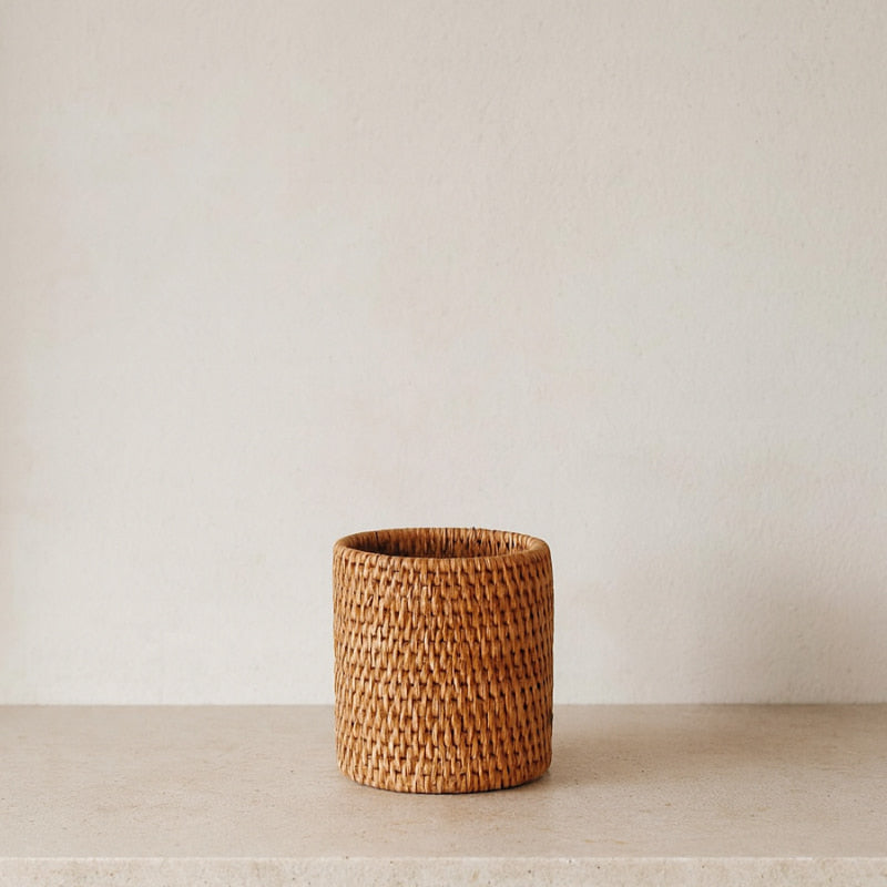 Woven rattan organizer on a neutral background