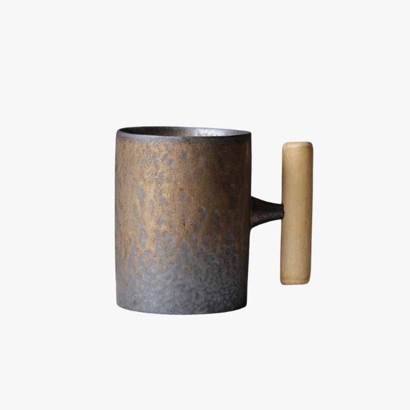 Wabi sabi black tea cup with wooden handle on a white background