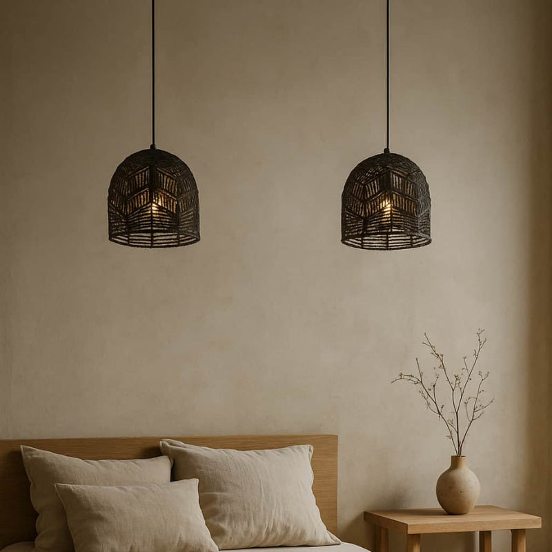 Bedroom with wooden bed, beige bedding, and two wabi sabi hanging light.