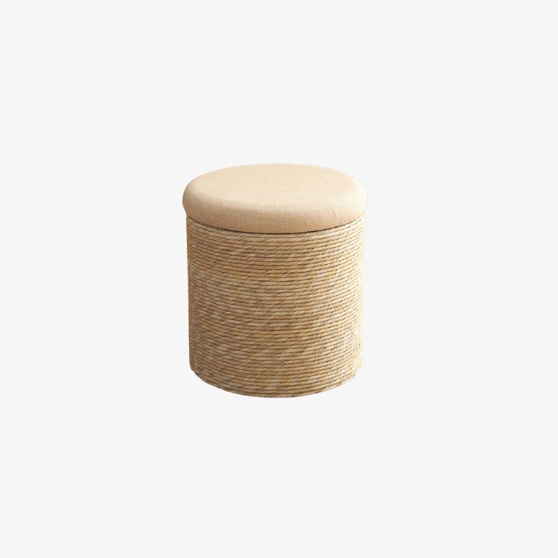 white linen pouf with woven body and beige cushion on a white background