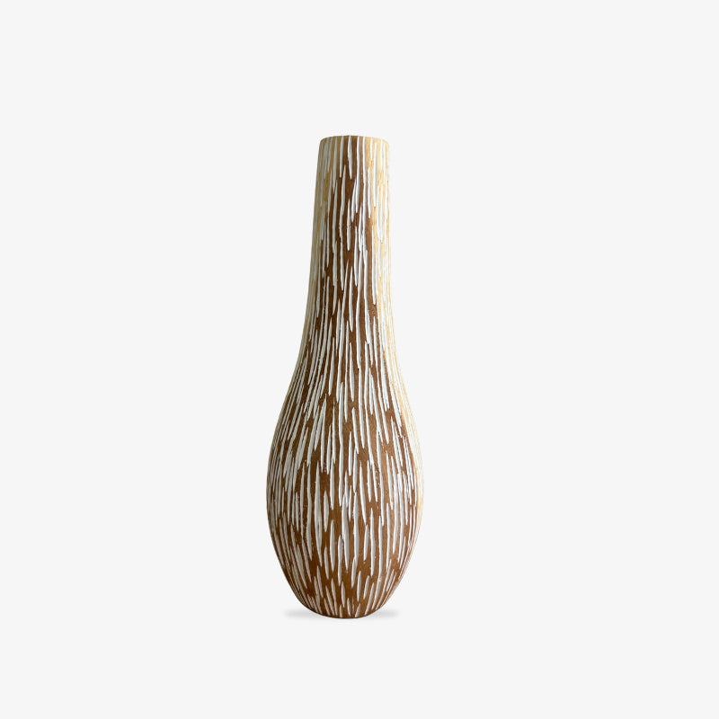 Wood carved vase with a unique pattern on a white background