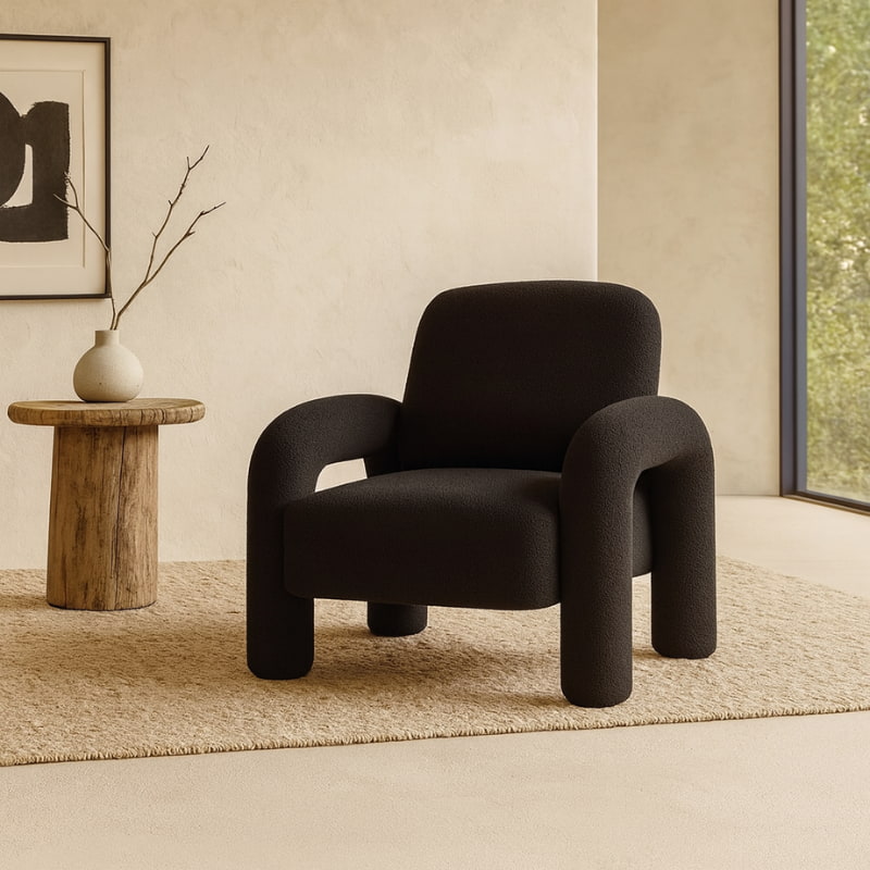 Modern Black Fluffy Chair in a minimalistic room with a wooden side table and framed artwork.