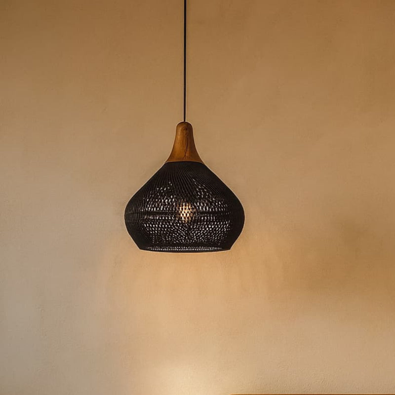 Black Wabi Sabi Pendant Light with wood against a beige wall