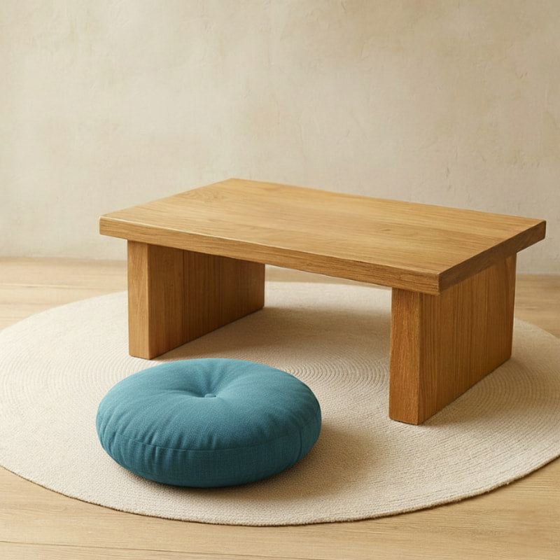 Wooden low table with a blue cushion japanese on a beige rug