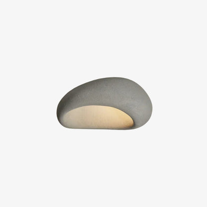 Cylindrical light fixture gray with a textured surface on a white background