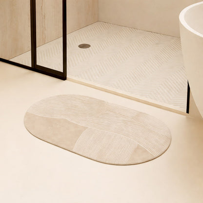 Beige japandi bath mat on a floor with a shower area in the background
