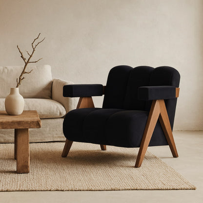 Black Japandi Style Armchair with wooden legs in a living room setting