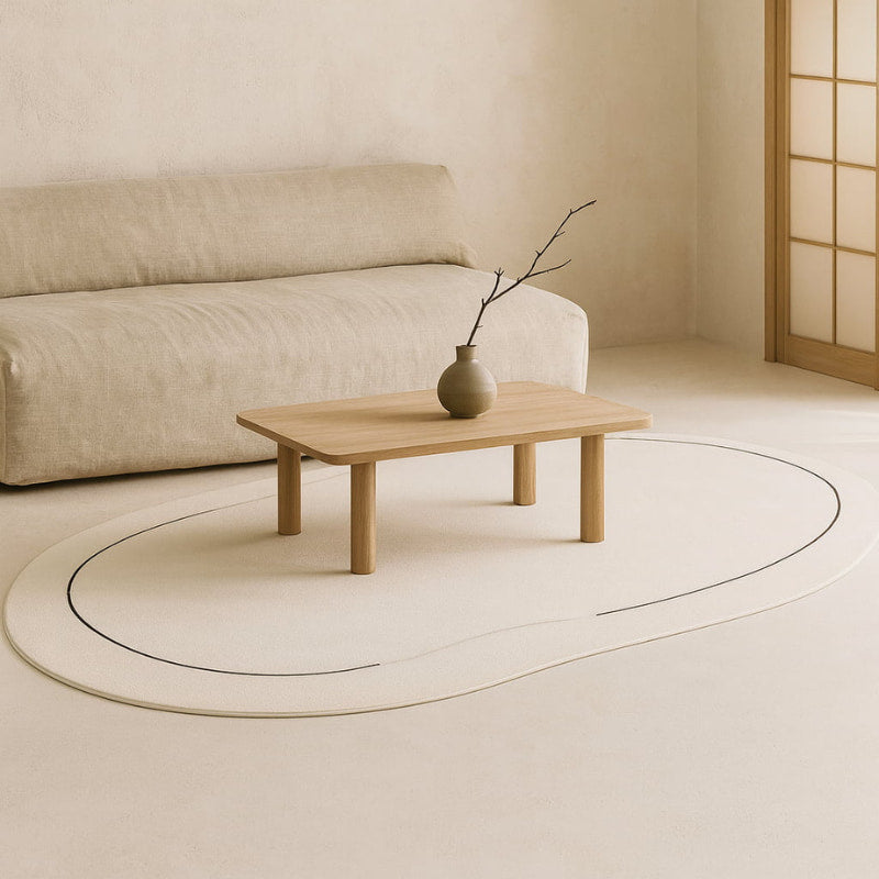 Minimalist living room with a wooden coffee table and a japandi carpet.
