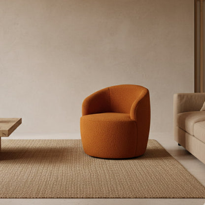 Orange swivel chair in a minimalistic room with a textured wall and stone sculpture.