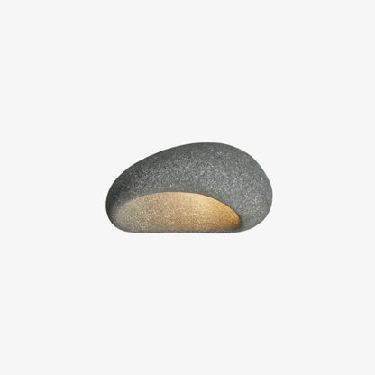 Round stone-like light fixture on a white background