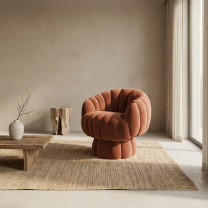 Velvet Accent Chair Swivel in a room with textured walls and a vase.