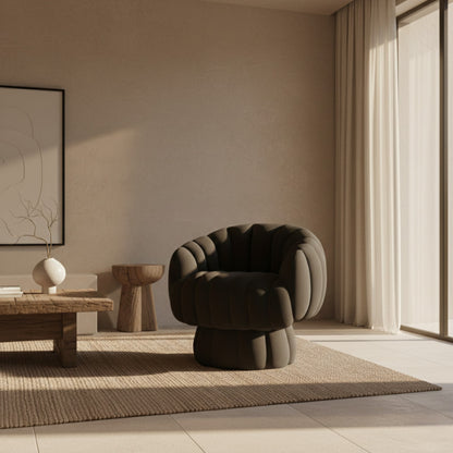 Velvet Swivel Accent Chair in a room with stone walls and a wooden side table.