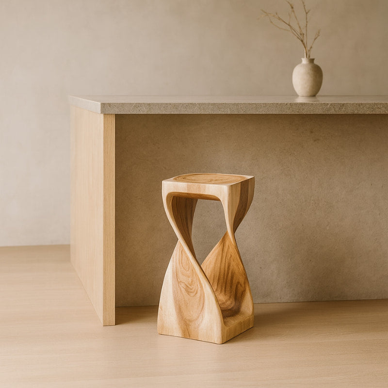 Wabi Sabi Counter Stools with a unique design in front of a wooden cabinet.