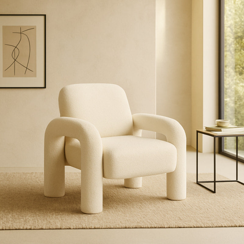 White Fluffy Chair in a minimalistic room with a wooden side table and vase.