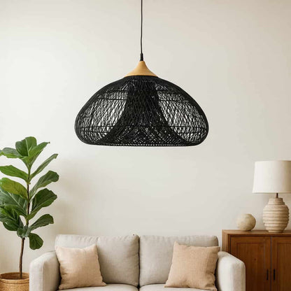 Living room with a gray sofa, wooden coffee table, and wicker hanging light fixtures