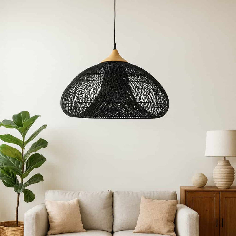 Living room with a gray sofa, wooden coffee table, and wicker hanging light fixtures