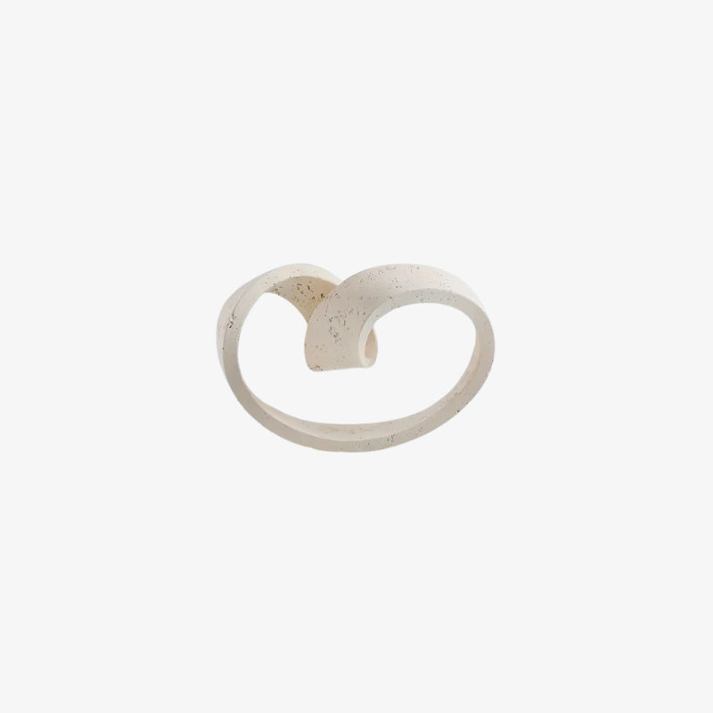 abstract modern home decor​ heart-shaped ring on a white background