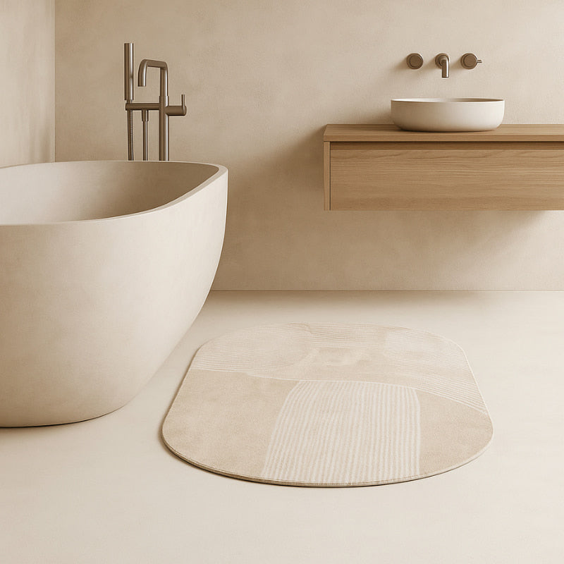 Bathroom mats​ with a freestanding bathtub, sink, and wooden vanity.