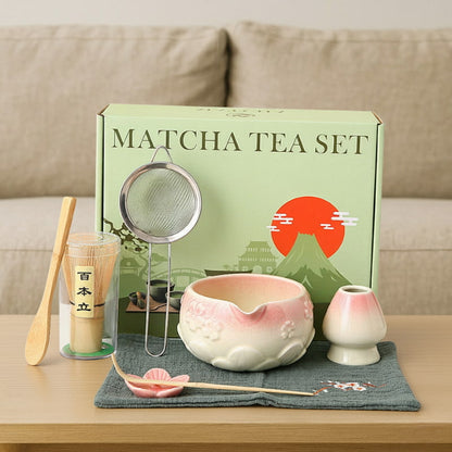 best matcha sets ceramic​ with a green box featuring Mount Fuji on a wooden table.
