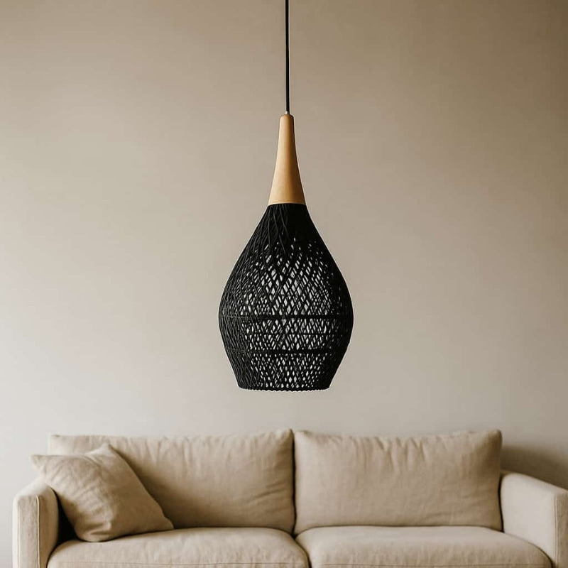 Beige sofa with a wooden coffee table and a black wicker light shade​.