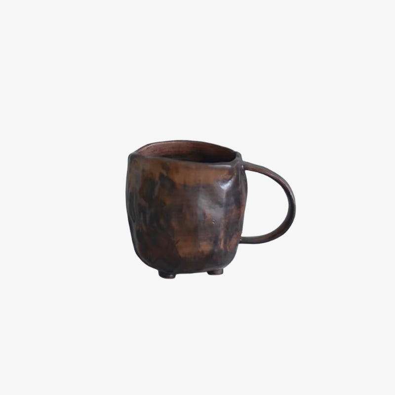 Brown tea cup wabi sabi on a white background