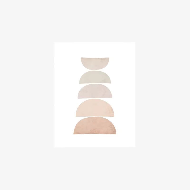 circle art print​ with geometric shapes on a wall in a minimalistic room.