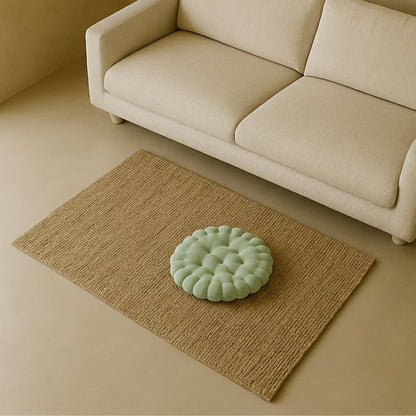 cushion sit on the floor and a sofa in a wabi sabi living room