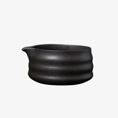 Black encha matcha tea​ ceramic pot with ribbed design on a white background