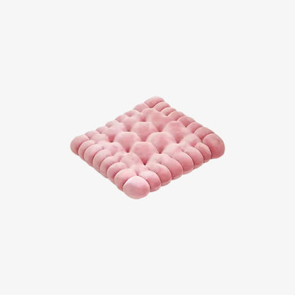 Pink floor cushion design​ with a textured pattern on a white background