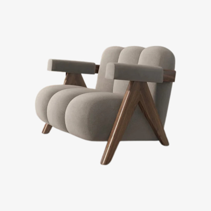 Grey armchair with wooden legs on a white background