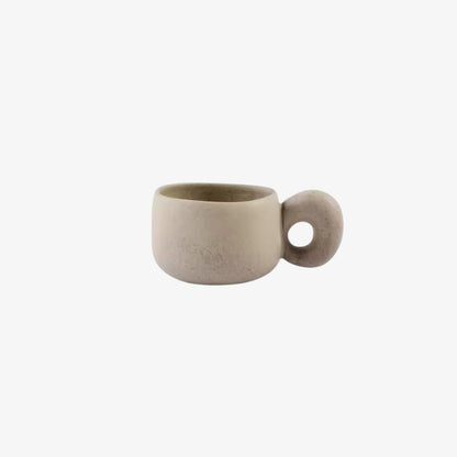 handmade ceramic mugs​ with a round handle on a white background
