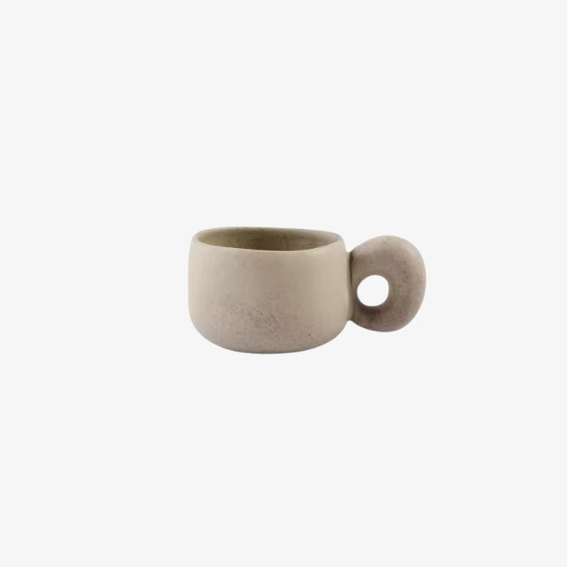 handmade ceramic mugs​ with a round handle on a white background