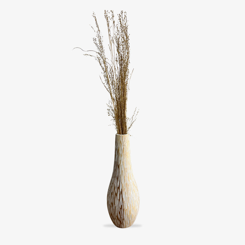 Decorative handmade white wood vase​ with dried plants on a white background